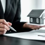 real-estate-agent-working-sign-agreement-document-contract-for-home-loan-insurance_t20_O0OgQb